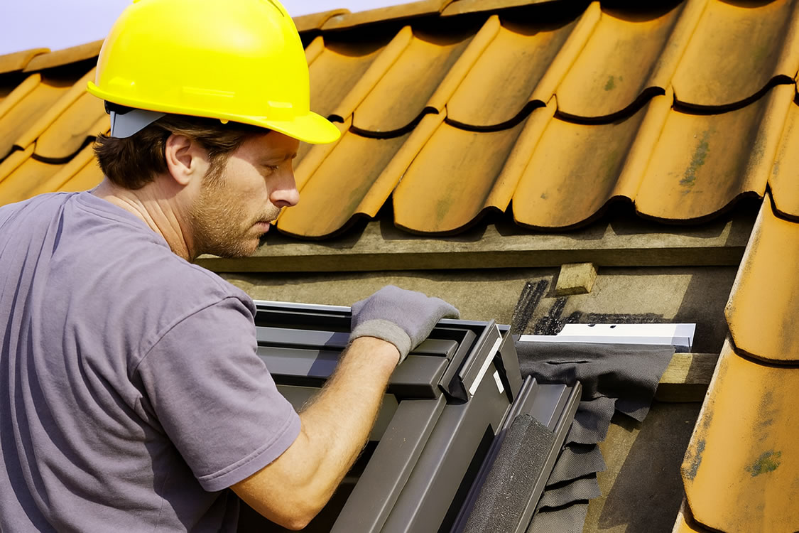 Roof window emergency repair by a roofer